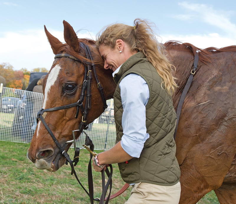 Beth Supik shares a sweet moment with Ebanour after once of his wins. Photo by Tod Marks