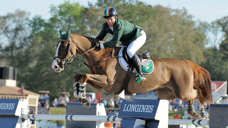 Cian O'Connor celebrated mid-air as he clinched Team Ireland's win in the $100,000 FEI Nations Cup at HITS Ocala. Photo by Molly Sorge