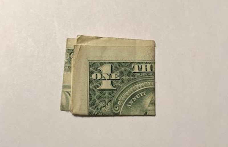 A photo of the actual dollar bill, taken by Durand and included in his Facebook post with the story.